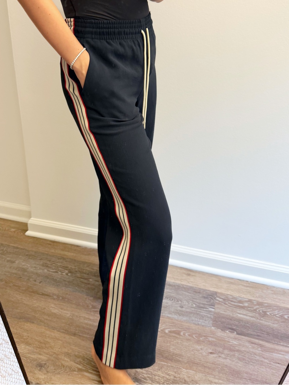 Aritzia Black Track Pants with Cream and Red Side Stripes